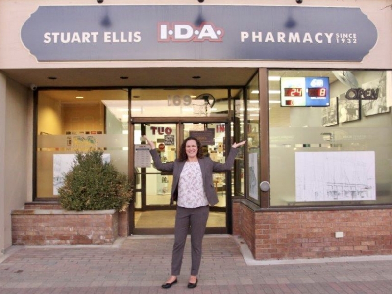 Melissa in front of pharmacy
